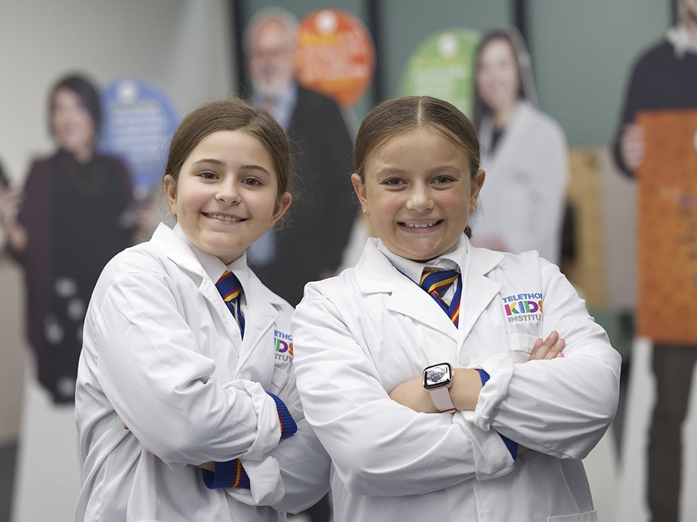 Kids wearing lab coats