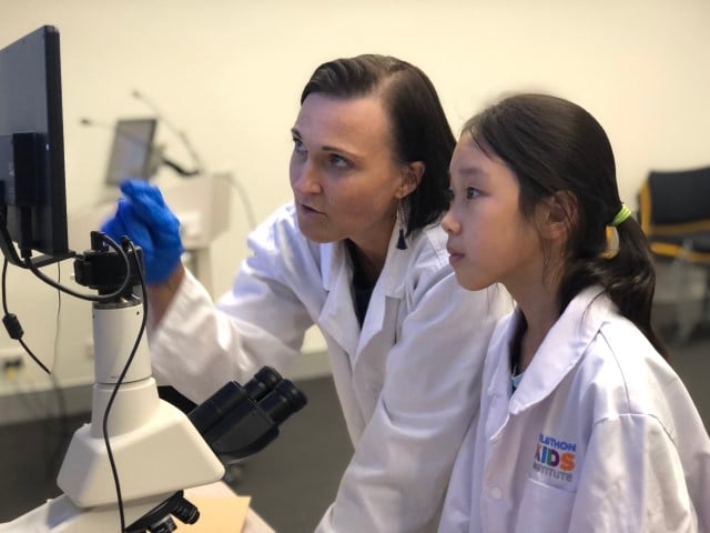 researcher teaching a student