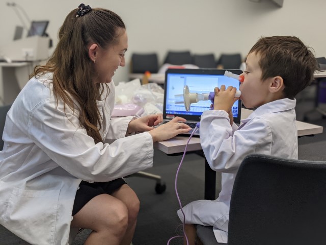 researcher teaching a student